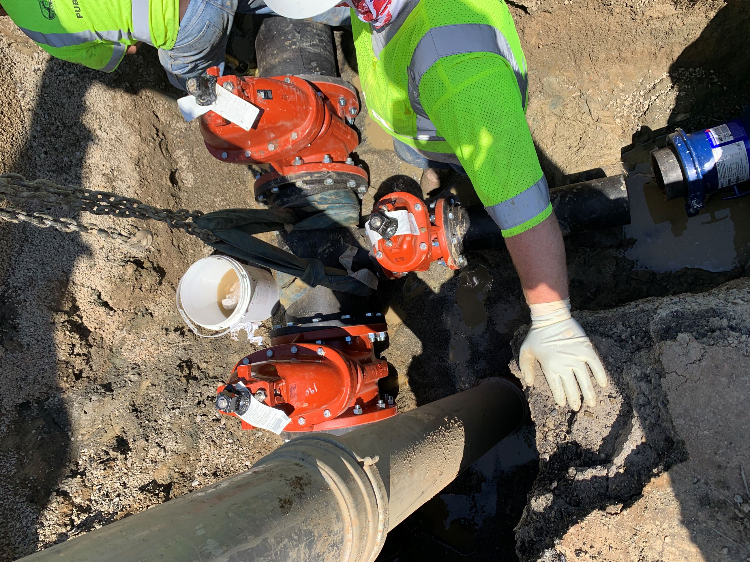 Public Works Crew installs valves on water main