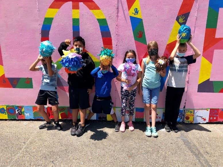Camp HBG campers in front of pink wall